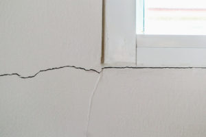 New house wall crack near window frame