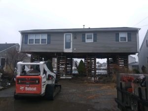 Ranch Home Lift On Cribbing Towers In Lavallette, New Jersey