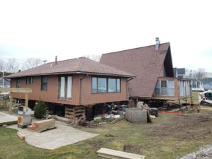 We lifted this 67-ton home 5.5 feet for a foundation extension