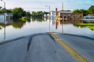 Flooded business street in a small town.